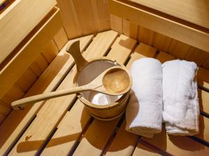 Indoor of a Finnish sauna, with a water bucket , Spa and Wellness concept in a hotel