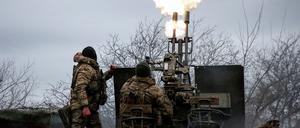 Ukrainian servicemen from air defence unit of the 93rd Mechanized Brigade fire an anti aircraft cannon at a frontline, amid Russia's attack on Ukraine, near the town of Bakhmut, Ukraine March 6, 2024. Radio Free Europe/Radio Liberty/Serhii Nuzhnenko via REUTERS