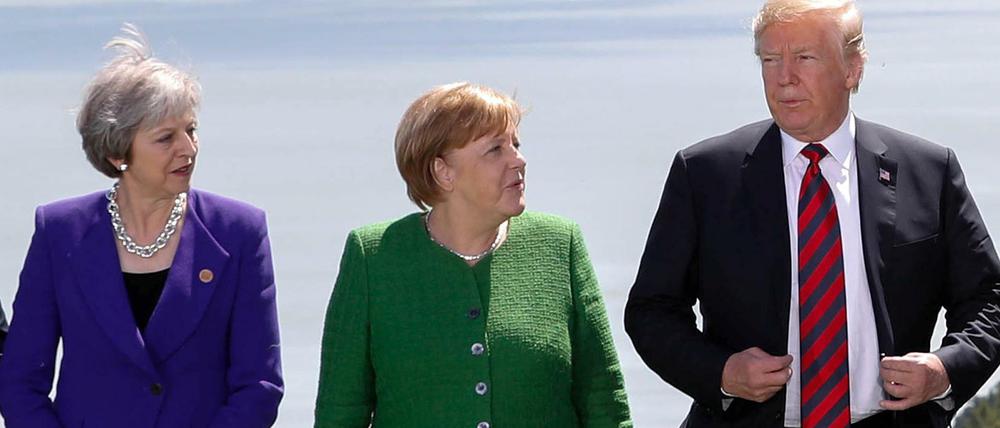 Die britische Premierministerin Theresa May, neben Angela Merkel und US-Präsident Donald Trump.