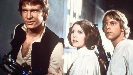 Die Zukunft von gestern. Harrison Ford, Carrie Fisher und Mark Hamill spielten 1977 die Hauptrollen in „Krieg der Sterne“. Fünf weitere „Star-Wars“-Filme folgten, wobei der erste Teil heute auf Grund seines Platzes in der Chronologie „Episode IV“ heißt. 