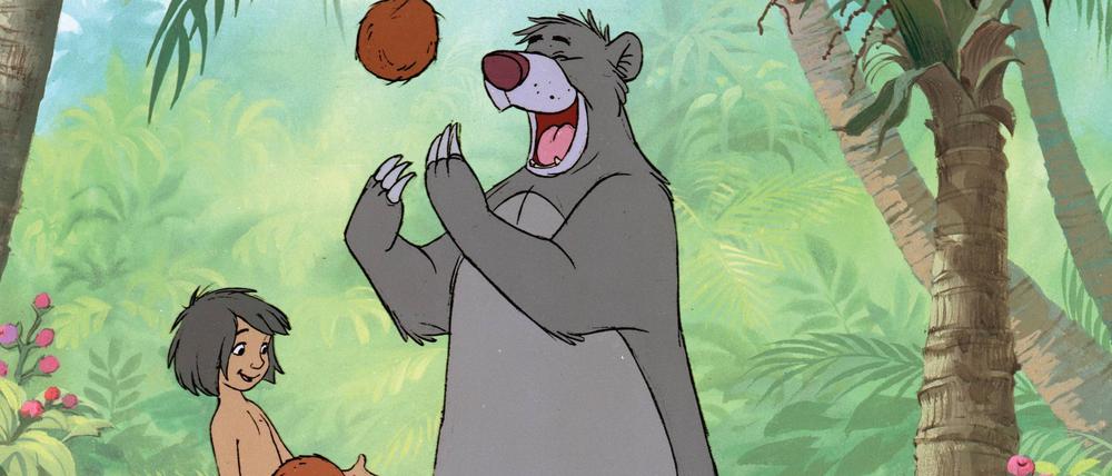 Bär Balu und Menschenjunge Mogli in Dschungelbuch: Seit Veröffentlichung ist der originale Zeichentrickfilm von 1967 bis heute der erfolgreichste Kinohit mit über 27 Millionen Besuchern.