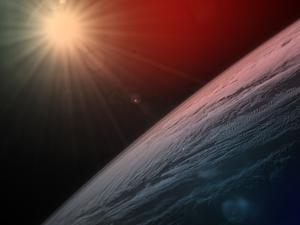 Die Sonne scheint über dem Horizont der Erde, während die Internationale Raumstation über der kanadischen Provinz Quebec kreist.