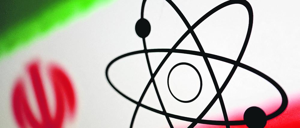 FILE PHOTO: The atomic symbol and the Iranian flag are seen in this illustration, July 21, 2022. REUTERS/Dado Ruvic/Illustration/File Photo