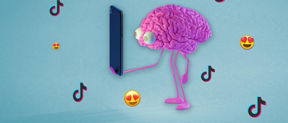 Ein comichaftes Gehirn mit großen Glubschaugen starrt in einen Handybildschirm, während um es herum Herzaugen-Emojis und Logos von TikTok fliegen. 