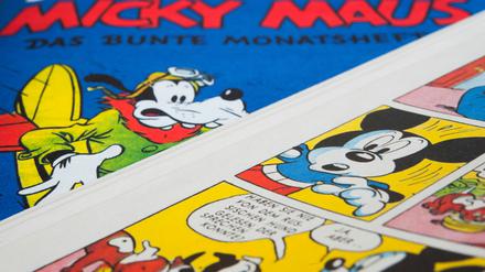Klassiker: Das Cover des ersten Micky-Maus-Hefts und einige Szenen aus dem Inneren der Zeitschrift.