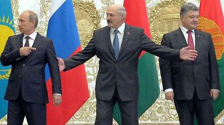 Wladimir Putin, Weißrusslands Machthaber Alexander Lukaschenko und Petro Poroschenko.