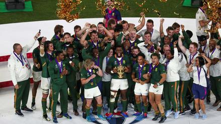 Lametta für alle: Südafrika feiert den dritten WM-Titel mit Grün und Gold.